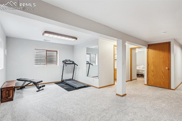 workout room featuring carpet flooring and baseboards