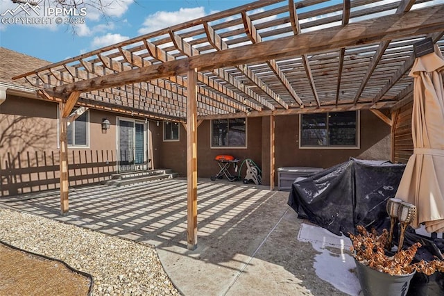 view of patio / terrace featuring fence