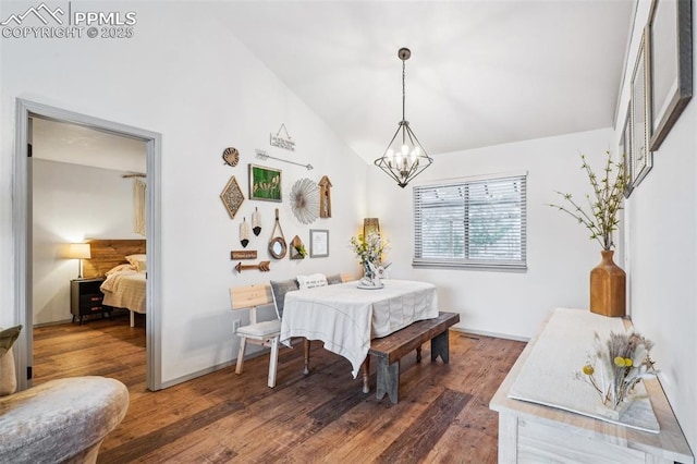 dining area featuring an inviting chandelier, baseboards, vaulted ceiling, and wood finished floors