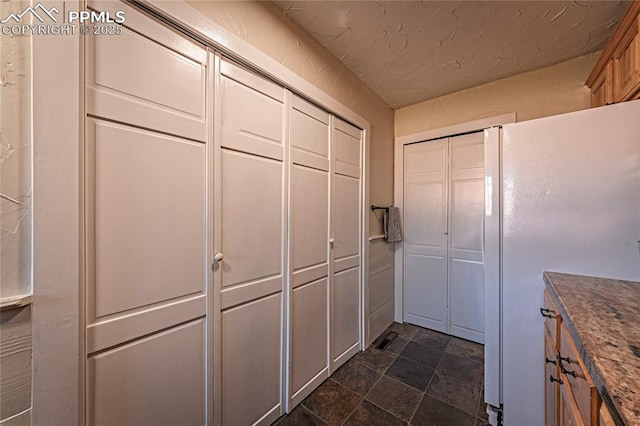 interior space featuring stone finish floor