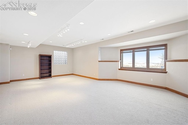 empty room with baseboards, recessed lighting, visible vents, and light colored carpet