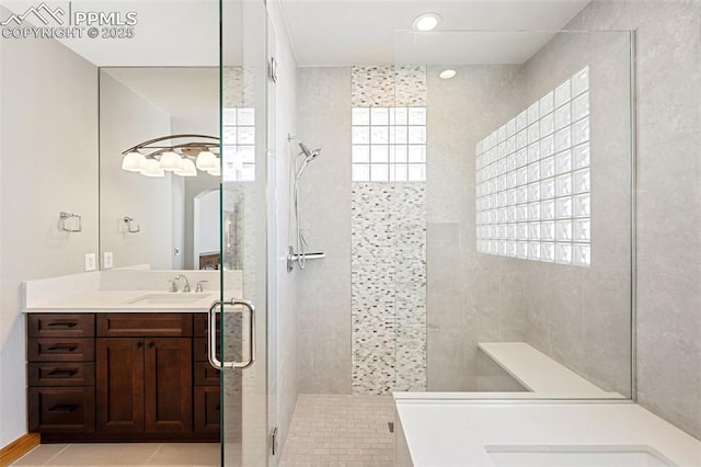 bathroom featuring a shower stall, vanity, and tile patterned floors