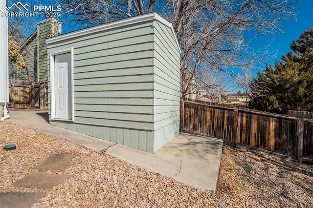 view of outbuilding with fence