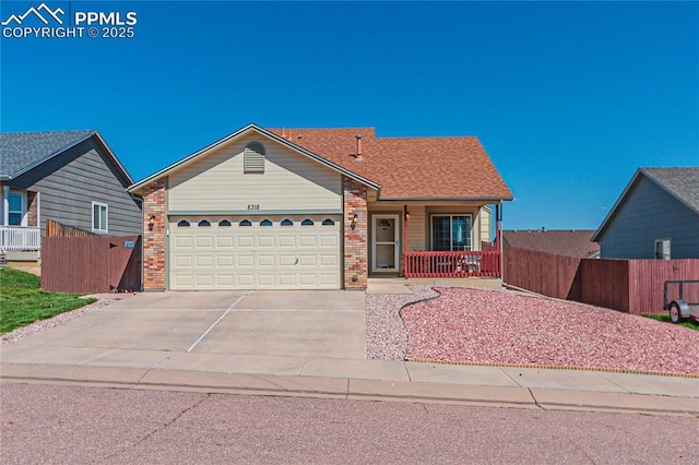 ranch-style home with driveway, an attached garage, fence, and brick siding