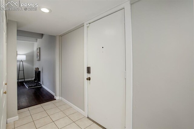 9995 E Harvard Ave Unit 155, Denver, CO 80231 - corridor featuring light tile patterned floors and baseboards