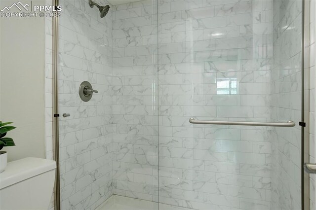 9995 E Harvard Ave Unit 155, Denver, CO 80231 - bathroom featuring a shower stall and toilet