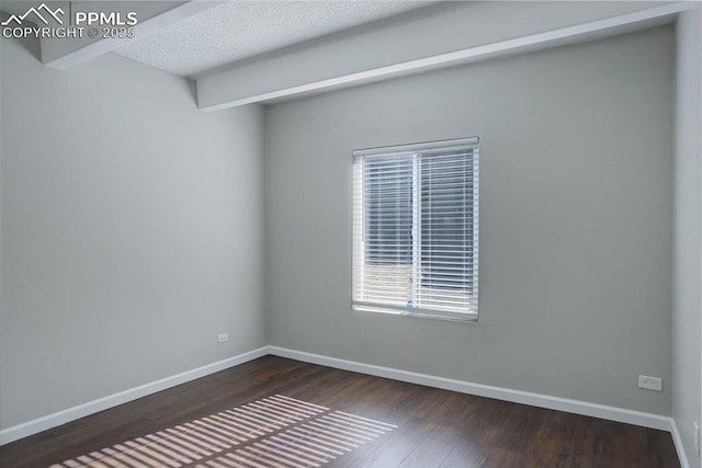 9995 E Harvard Ave Unit 155, Denver, CO 80231 - spare room featuring a textured ceiling, baseboards, and dark wood-style flooring