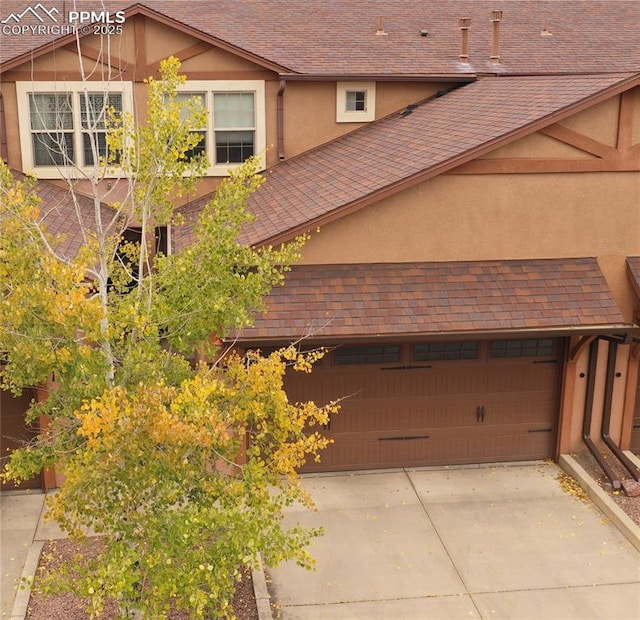 exterior space featuring concrete driveway