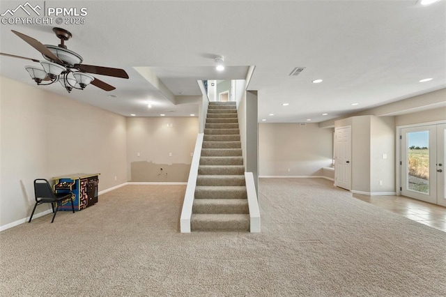 basement with french doors, stairway, carpet, and recessed lighting