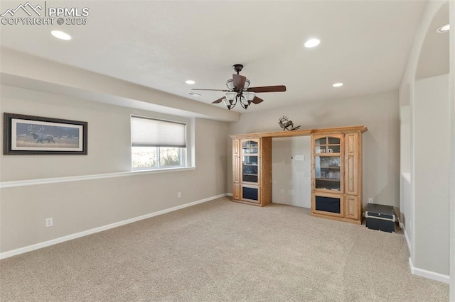 unfurnished living room with carpet floors, recessed lighting, baseboards, and a ceiling fan