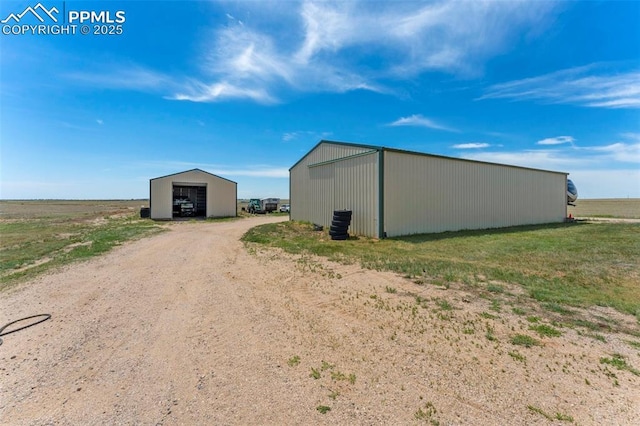 view of pole building with driveway