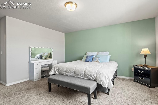 bedroom featuring light colored carpet and baseboards