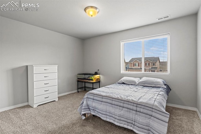 bedroom with visible vents, baseboards, and carpet flooring