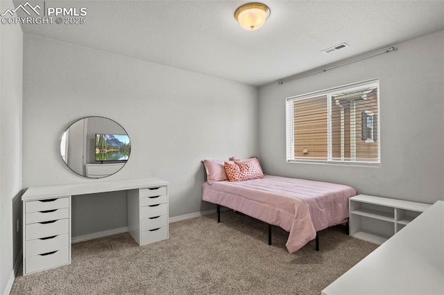 bedroom featuring carpet flooring, visible vents, and baseboards