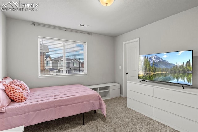 bedroom with carpet and visible vents