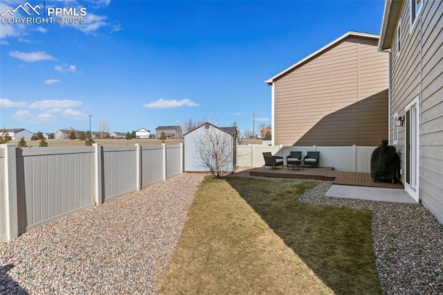 view of yard with a fenced backyard and a wooden deck