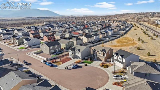 birds eye view of property with a residential view and a mountain view