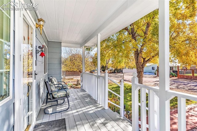 wooden deck featuring covered porch