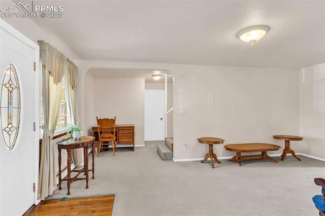 sitting room with carpet and baseboards