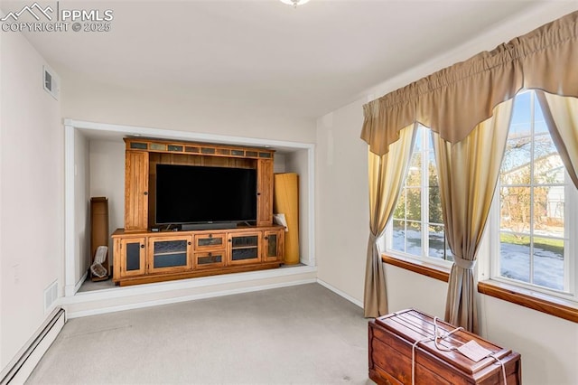 living area featuring carpet floors, visible vents, a baseboard heating unit, and baseboards