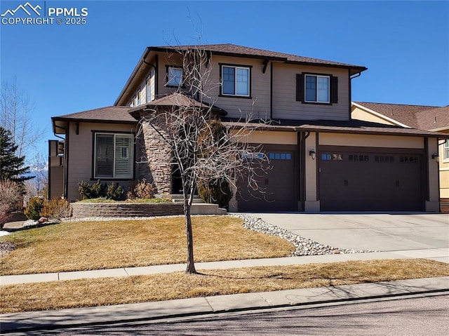 prairie-style home with concrete driveway and an attached garage