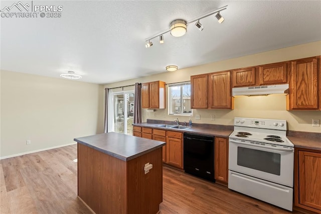 kitchen with wood finished floors, dishwasher, under cabinet range hood, and white range with electric cooktop