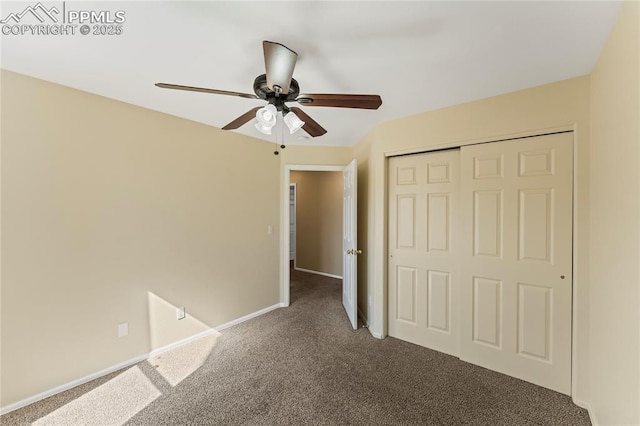 unfurnished bedroom with carpet, a closet, ceiling fan, and baseboards