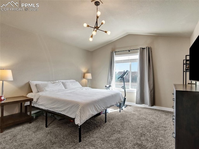 carpeted bedroom featuring vaulted ceiling, a chandelier, and baseboards