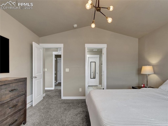 carpeted bedroom with vaulted ceiling, ensuite bath, baseboards, and an inviting chandelier