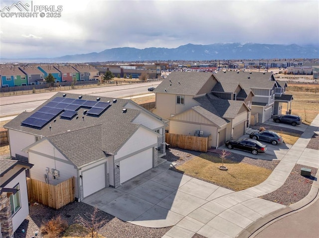 bird's eye view with a residential view and a mountain view