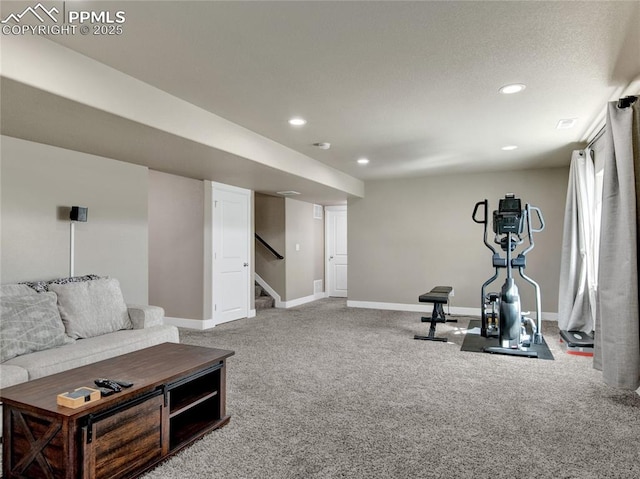 exercise area featuring recessed lighting, carpet flooring, and baseboards