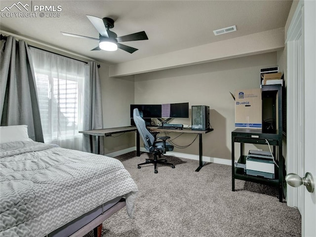 carpeted bedroom with a ceiling fan, visible vents, and baseboards