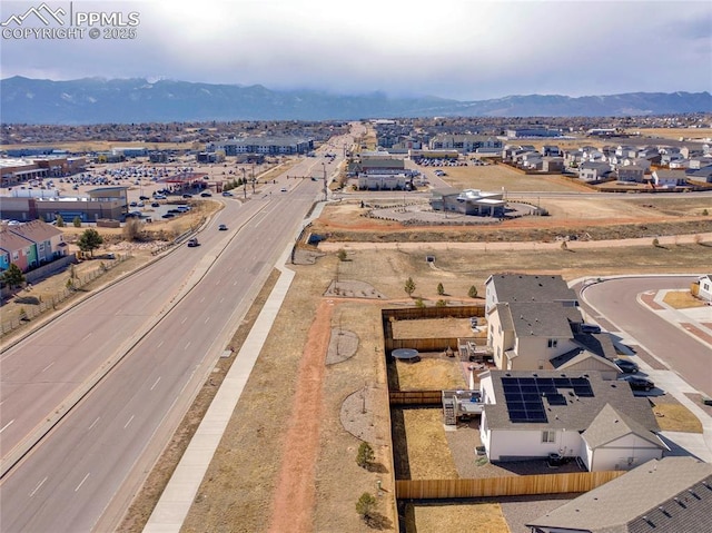 birds eye view of property featuring a mountain view