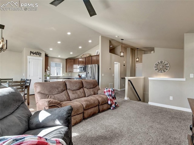 living room with lofted ceiling, recessed lighting, visible vents, light carpet, and baseboards