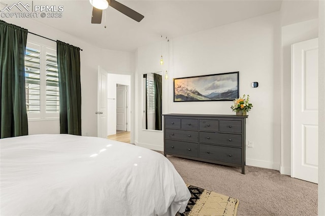 carpeted bedroom featuring a ceiling fan and baseboards