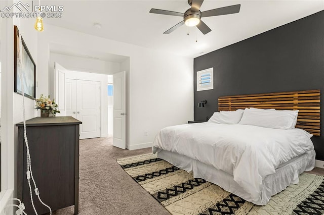 carpeted bedroom with a ceiling fan and baseboards