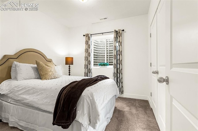 bedroom with visible vents, baseboards, and carpet flooring