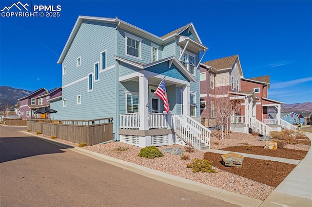 view of front of property with a residential view and covered porch