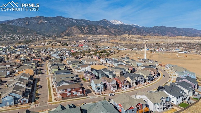 birds eye view of property with a residential view and a mountain view