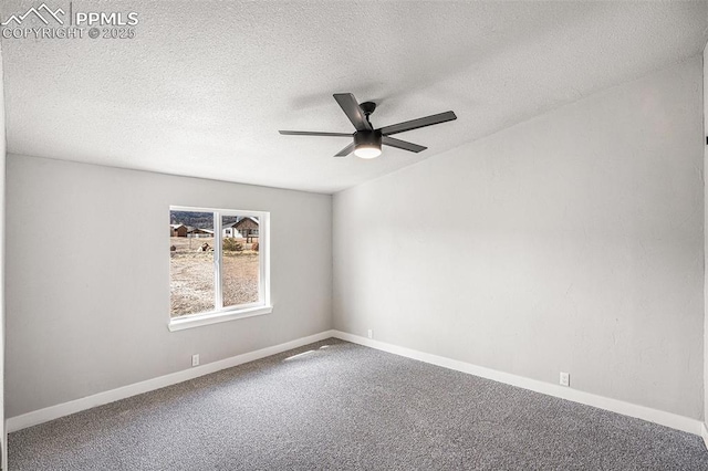 unfurnished room featuring a textured ceiling, carpet floors, a ceiling fan, and baseboards