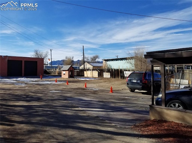 view of car parking with fence