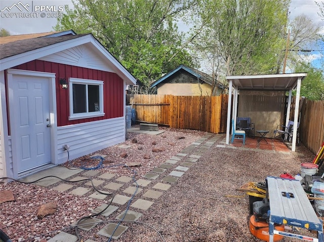 view of yard with an outbuilding and a fenced backyard