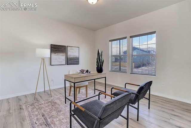 home office featuring light wood finished floors and baseboards