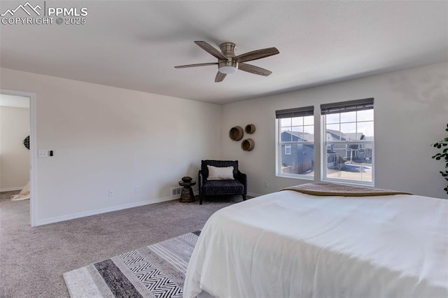 carpeted bedroom featuring visible vents, ceiling fan, and baseboards