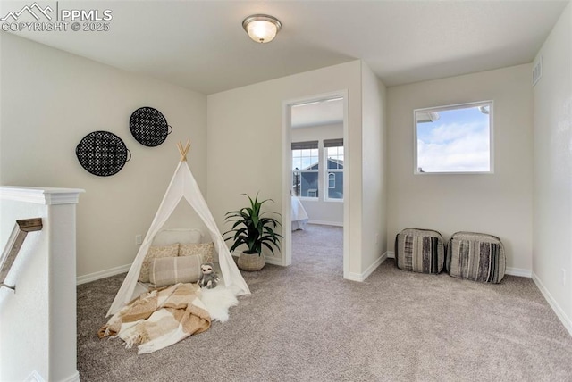 game room featuring carpet floors and baseboards