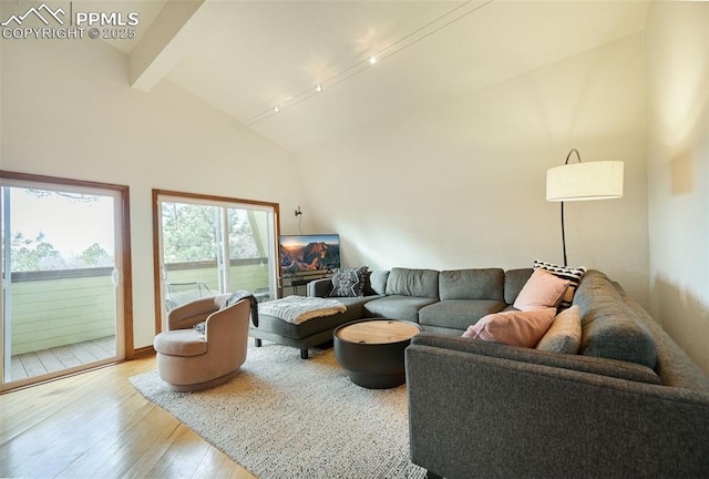 living area with high vaulted ceiling, beamed ceiling, and wood-type flooring