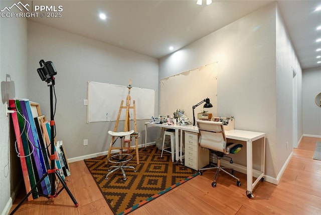 home office with baseboards, wood finished floors, and recessed lighting