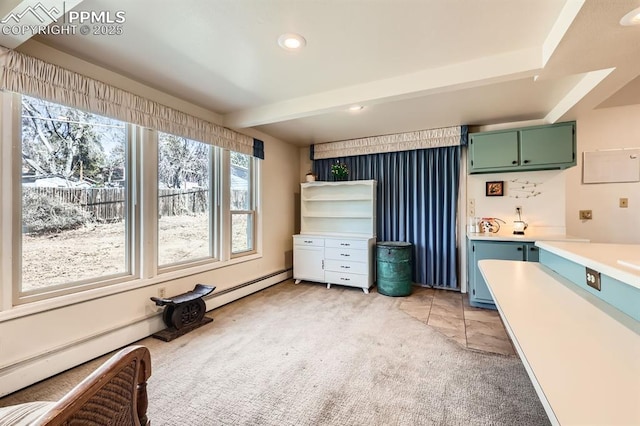 kitchen featuring light carpet, beamed ceiling, light countertops, and green cabinetry