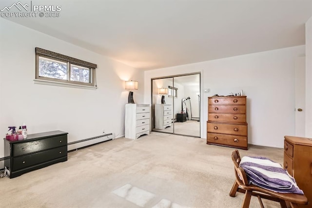 bedroom with light colored carpet, a closet, and a baseboard radiator