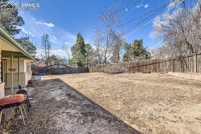 view of yard with a fenced backyard